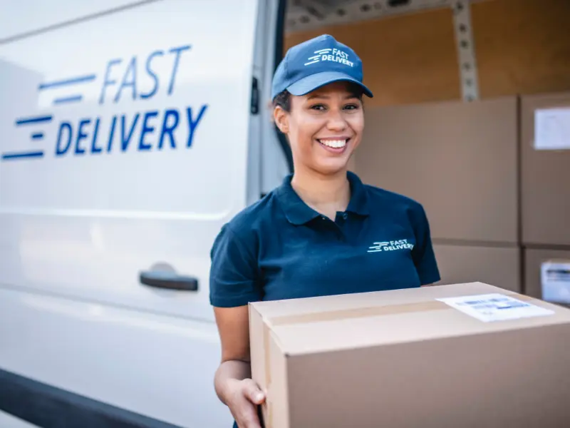 Delivery driver delivering a package.