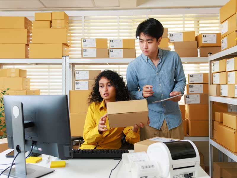 A couple opening a box.