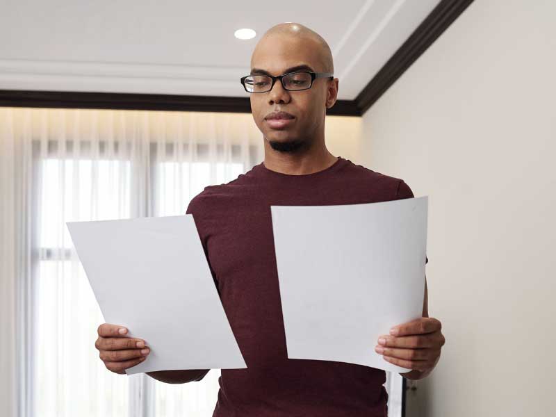 Man reading a packing slip